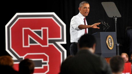 President Obama stands at a lectern beside an NC State block S as he announces the creation of PowerAmerica.