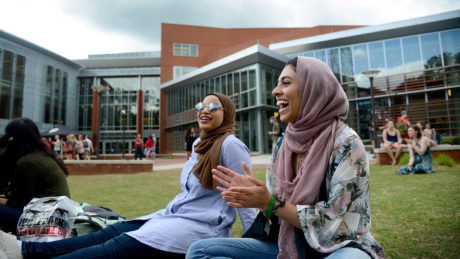 Students chat in the grass outside of Talley Student Union.
