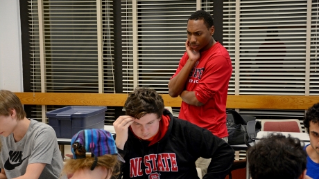 Justin Lockett watches other chess games.