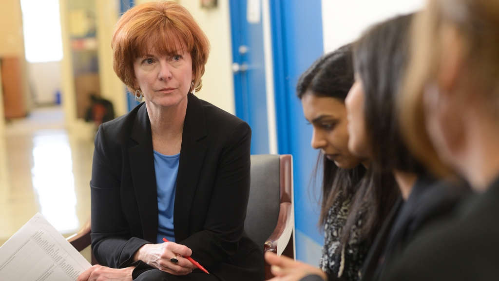 Mary Haskett talks with students.
