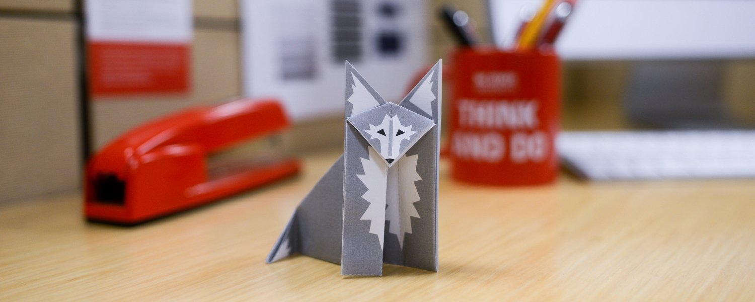 paper origami wolf on desk