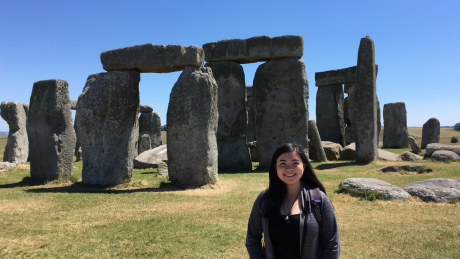 student standing in front of Stonehenge