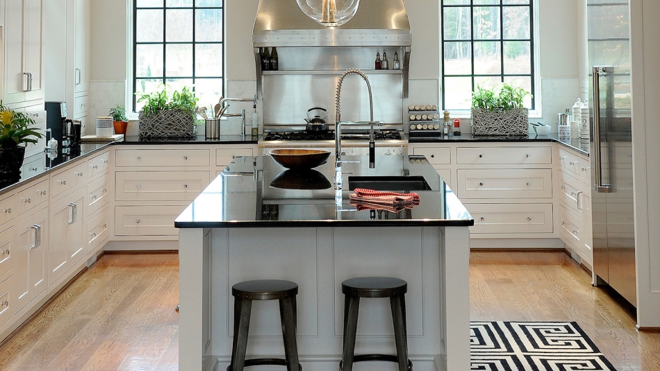 kitchen with barstools next to island