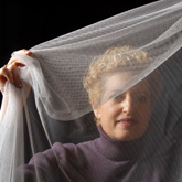 zoom to see a larger version of College of Textiles' Marian McCord checks out mosquito netting. photo