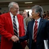 zoom to see a larger version of Lonnie Poole and College of Management Dean Ira Weiss shake hands at the announcement of the Pooles' gift to NC State. photo