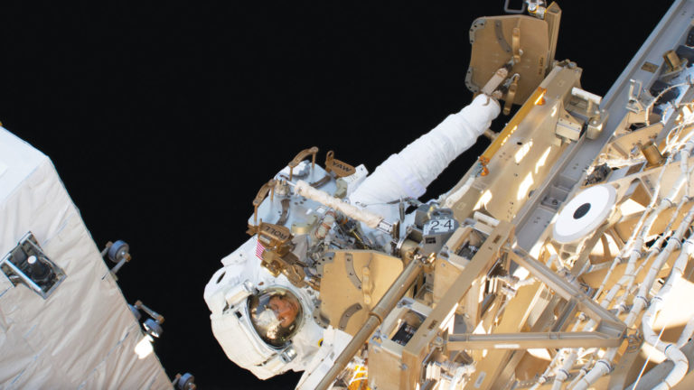 NC State alumna and astronaut Christina Koch dons her spacesuit board the International Space Station.