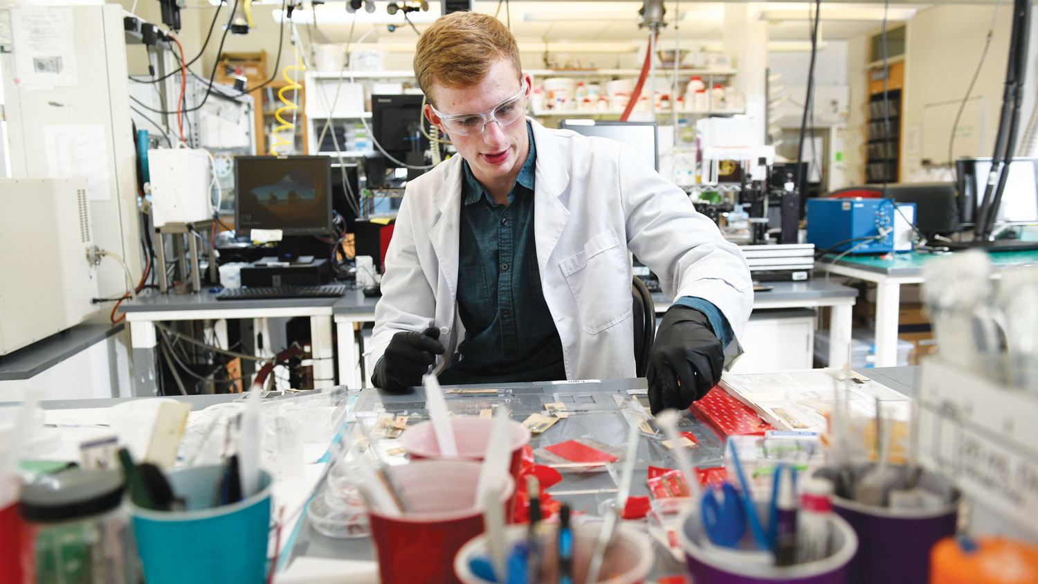 Undergraduate researcher Neil Baugh, a Goldwater Scholar, works in a lab.