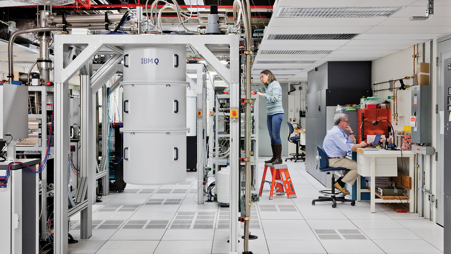 A woman works inside IBM's quantum computer.