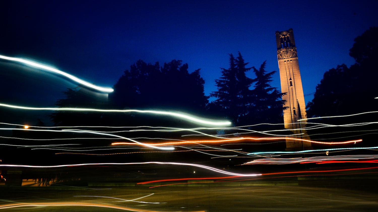The NC State Belltower at dusk and night. Photo by Marc Hall